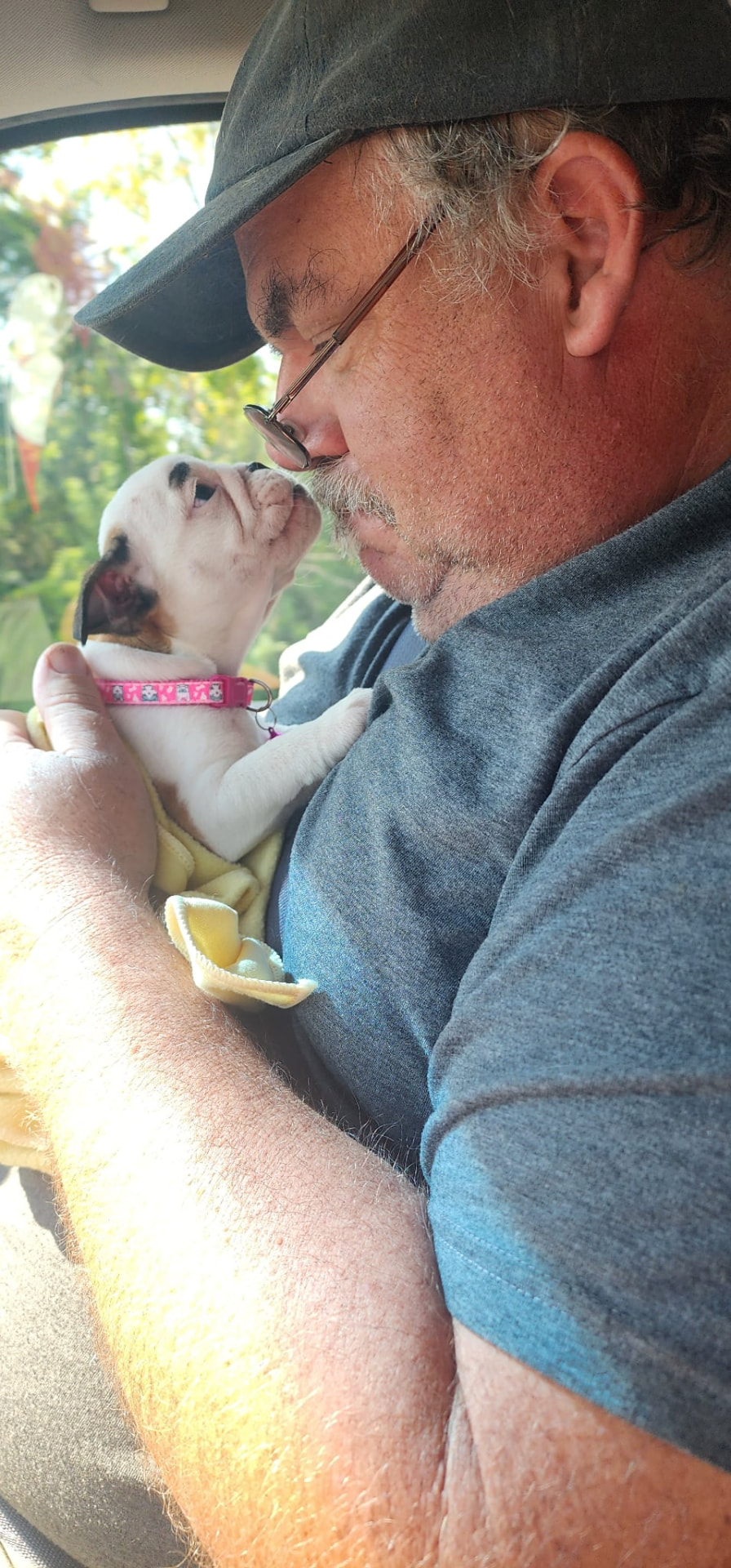 Rob holding a Smooch-A-Bulls English Bulldog puppy